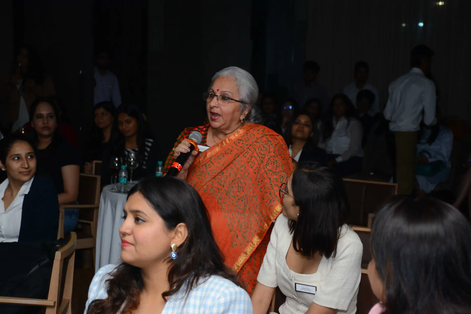 Conference speaker at podium 26