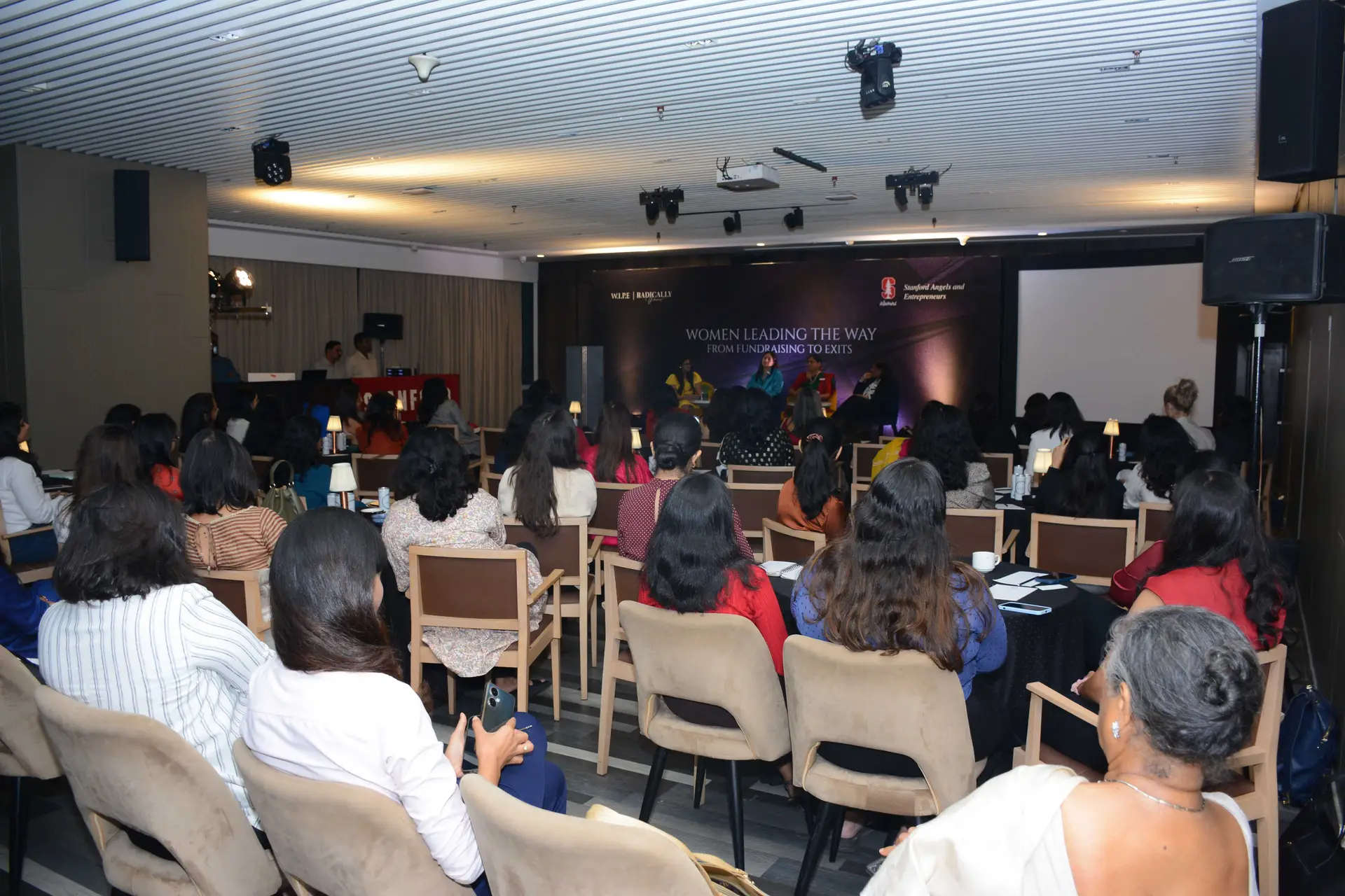 Conference speaker at podium 13