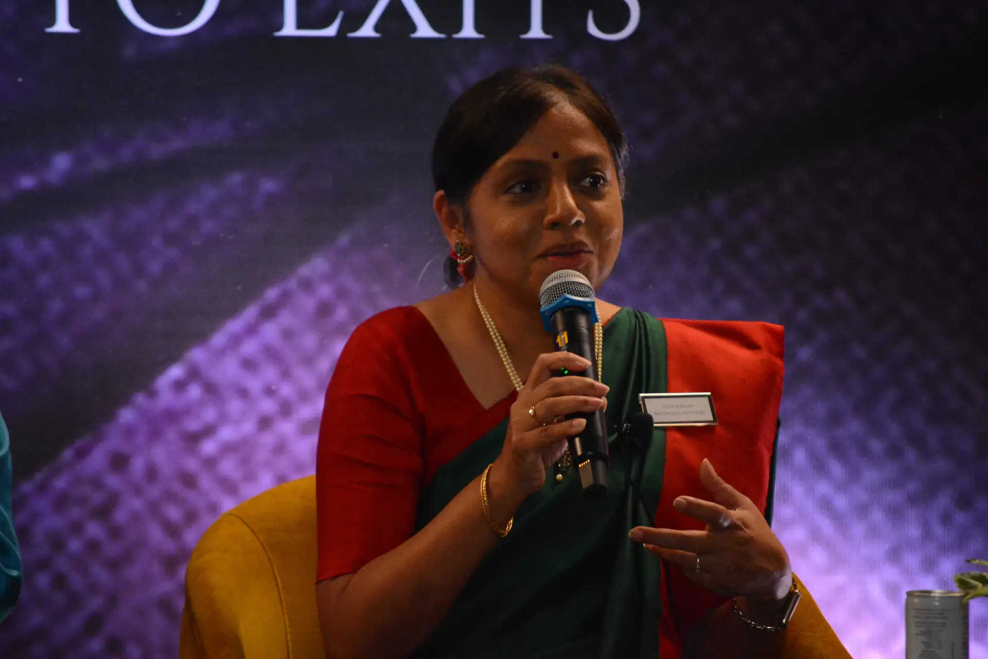 Conference speaker at podium 16