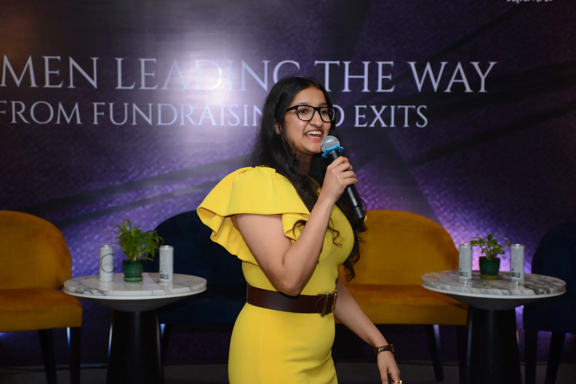 Conference speaker at podium 6