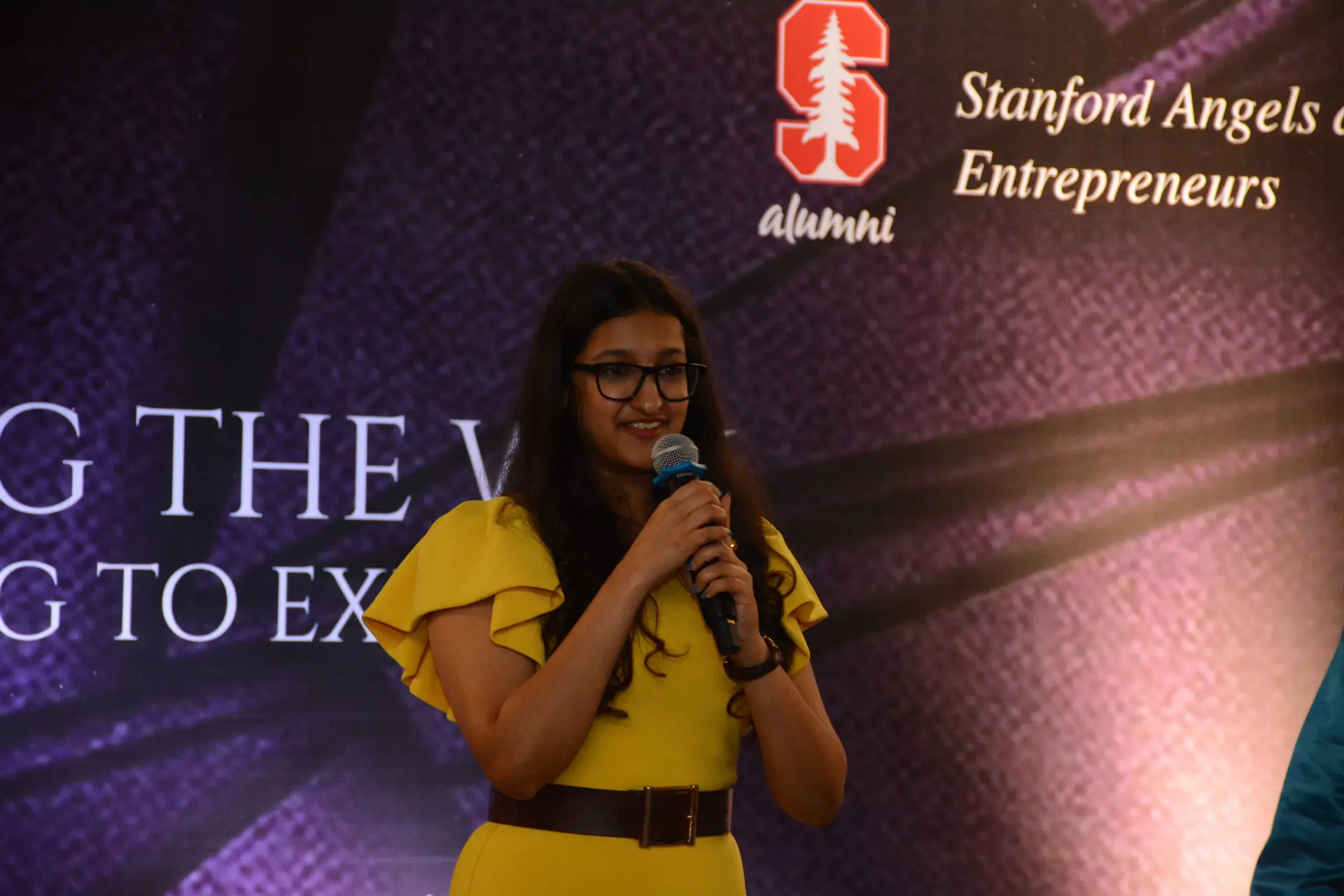 Conference speaker at podium 8